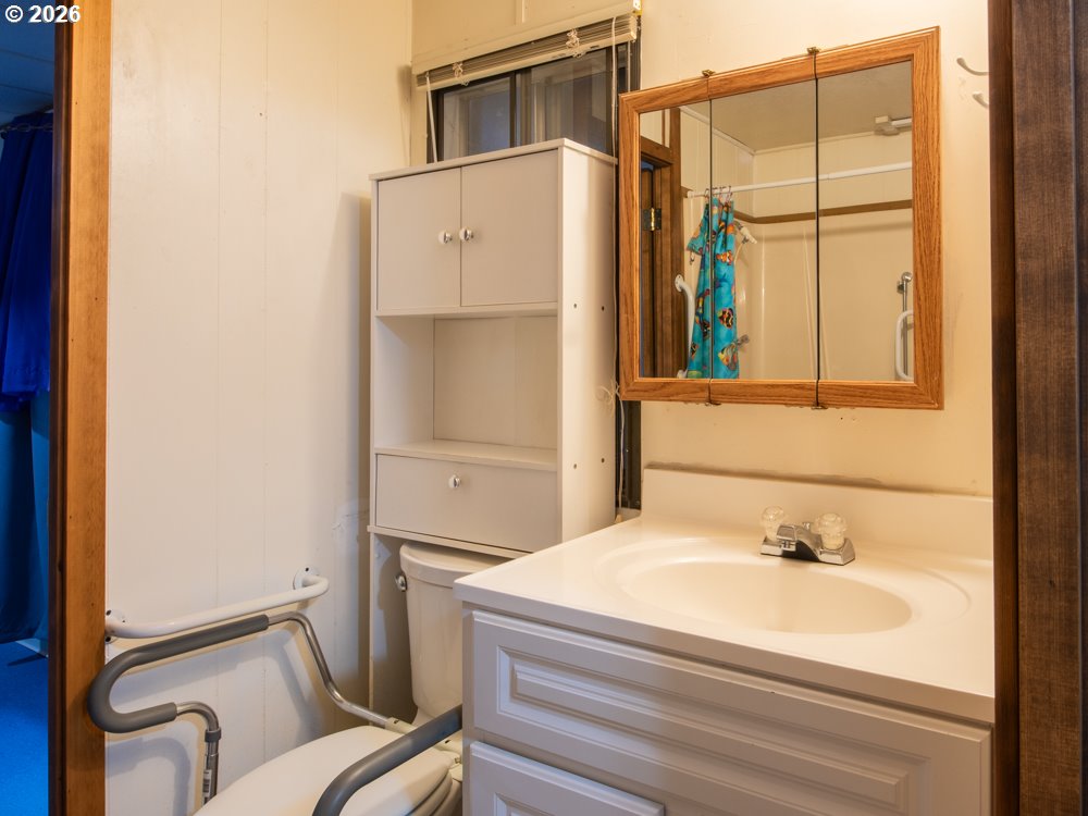 5335 Main Street Springfield, OR 97478 - Photo 31 of 43 a bathroom with a sink and a shower
