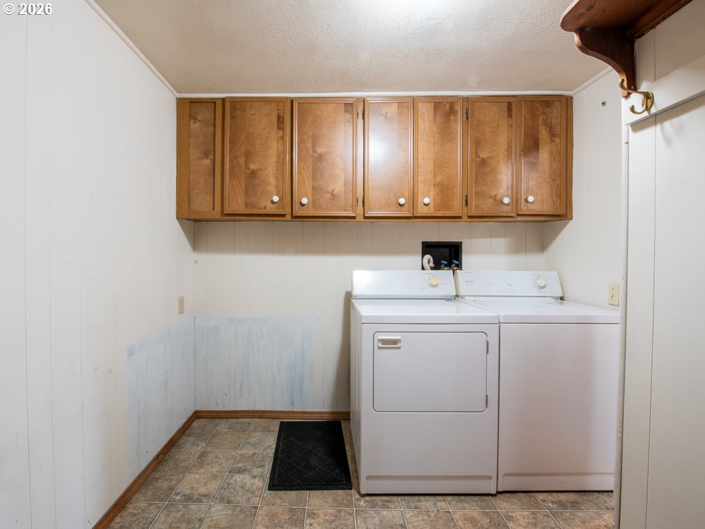 5335 Main Street Springfield, OR 97478 - Photo 32 of 43 a bathroom with a sink a mirror and cabinets