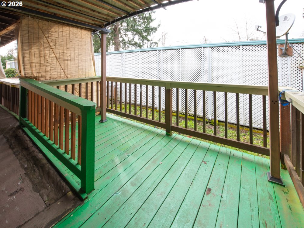 5335 Main Street Springfield, OR 97478 - Photo 37 of 43 a view of deck with wooden floor and fence