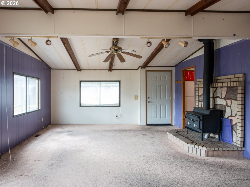 5335 Main Street Springfield, OR 97478 - Photo 8 of 43 a view of a livingroom with furniture and staircase