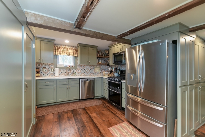 36 Main Street Flanders, NJ 07836 - Photo 8 of 49 a kitchen with a refrigerator and a sink