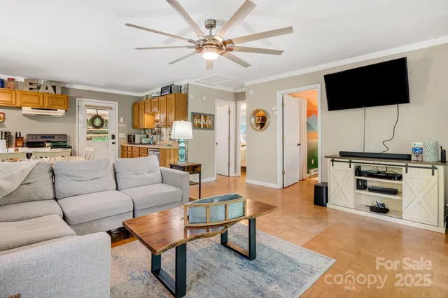 a living room with furniture and a flat screen tv