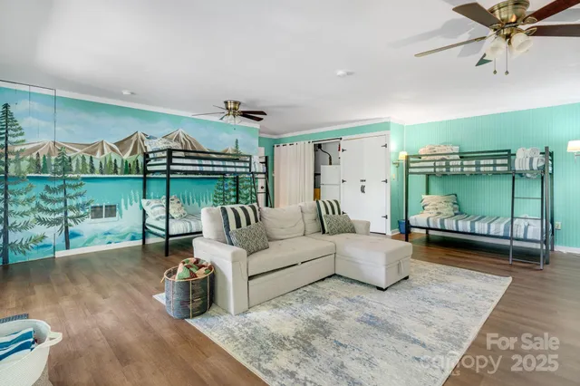 a living room with furniture and a floor to ceiling window