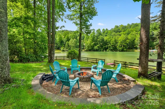 a view of a lake with couches in patio