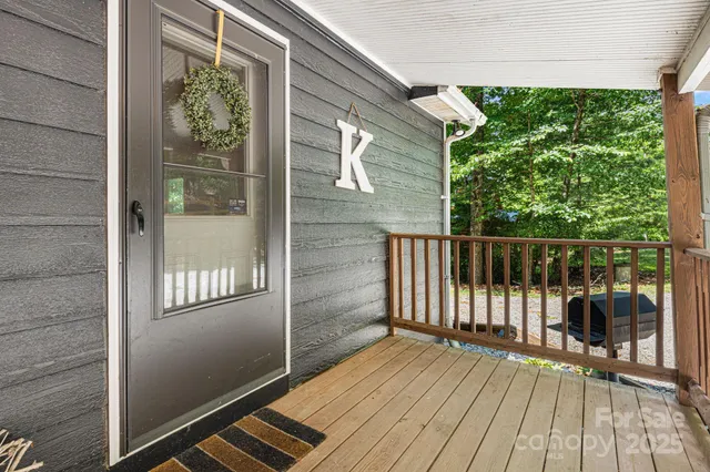 a view of a balcony with wooden floor