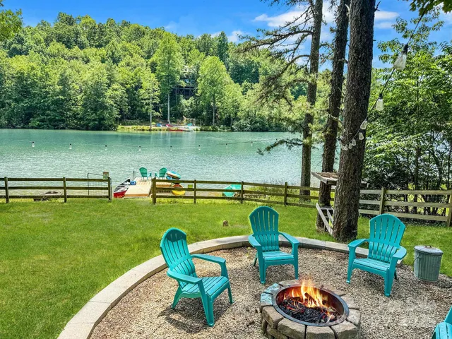 a view of a lake with outdoor seating space
