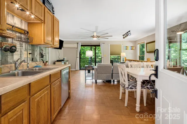 a large kitchen with a large window and furniture