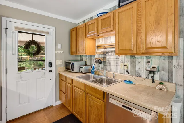 a kitchen with a sink a cabinets and window