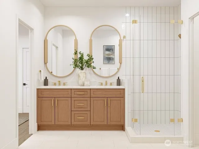 a bathroom with a double vanity sink mirror and shower