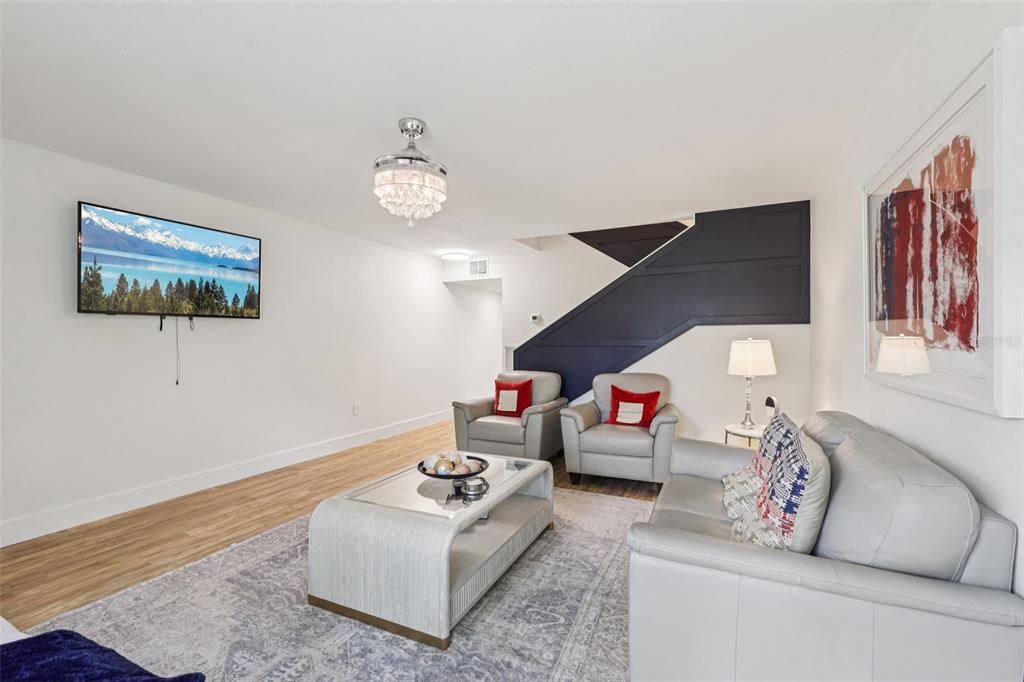 4471 Vieux Carre Circle, Unit 4471 Tampa, FL 33613 - Photo 12 of 58 a living room with furniture and wooden floor
