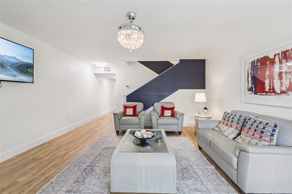 4471 Vieux Carre Circle, Unit 4471 Tampa, FL 33613 - Photo 13 of 58 a living room with furniture and a wooden floor