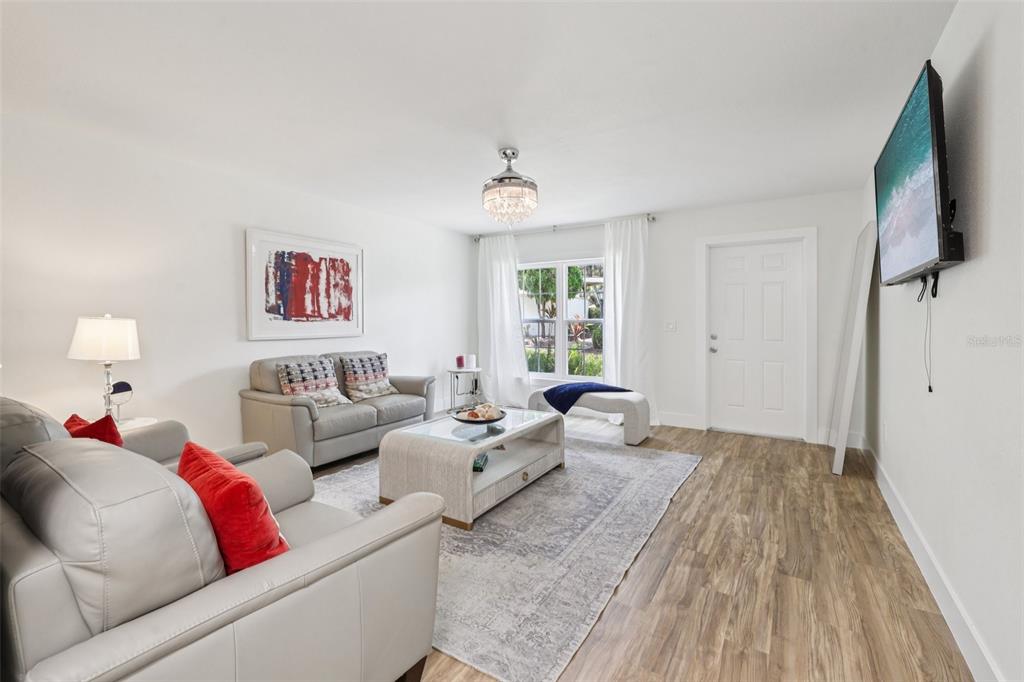 4471 Vieux Carre Circle, Unit 4471 Tampa, FL 33613 - Photo 14 of 58 a living room with furniture window and a wooden floor