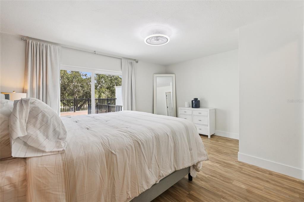 4471 Vieux Carre Circle, Unit 4471 Tampa, FL 33613 - Photo 24 of 58 a bedroom with a bed and a large window