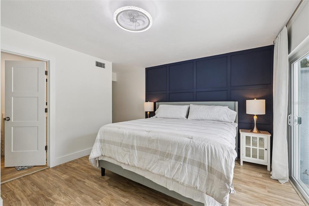 4471 Vieux Carre Circle, Unit 4471 Tampa, FL 33613 - Photo 26 of 58 a bedroom with a bed and a table