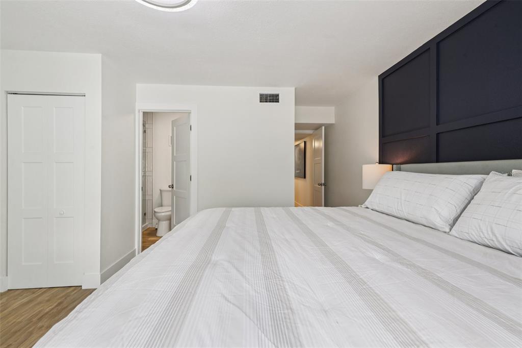 4471 Vieux Carre Circle, Unit 4471 Tampa, FL 33613 - Photo 27 of 58 a bedroom with a bed and closet