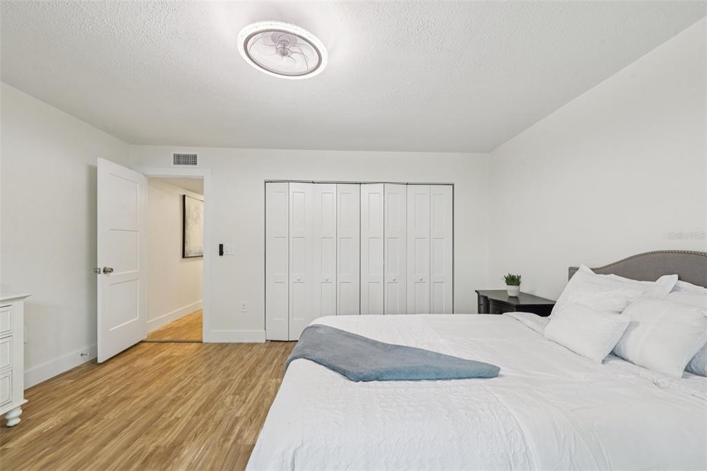 4471 Vieux Carre Circle, Unit 4471 Tampa, FL 33613 - Photo 31 of 58 a bedroom with a bed and a closet