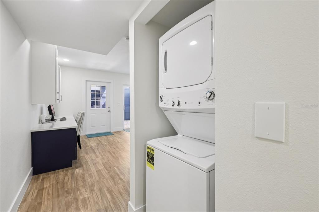 4471 Vieux Carre Circle, Unit 4471 Tampa, FL 33613 - Photo 34 of 58 a view of washer and dryer with bathroom in the background