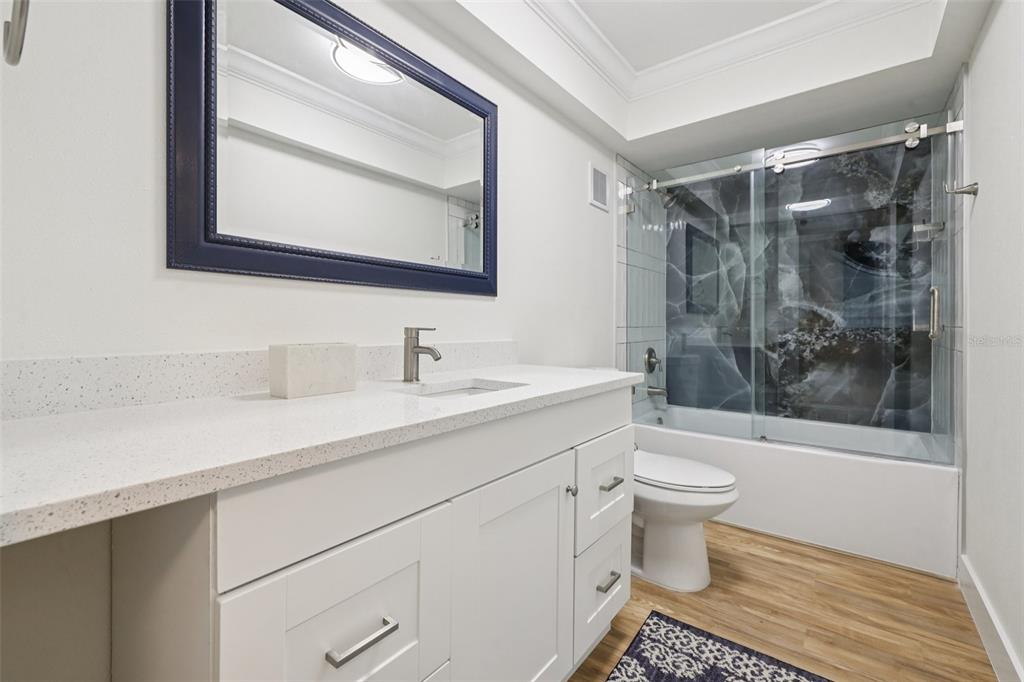 4471 Vieux Carre Circle, Unit 4471 Tampa, FL 33613 - Photo 35 of 58 a bathroom with a sink toilet and shower