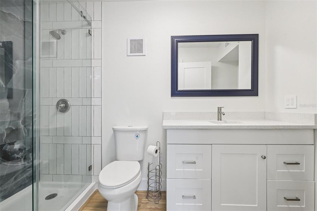 4471 Vieux Carre Circle, Unit 4471 Tampa, FL 33613 - Photo 37 of 58 a bathroom with a toilet sink and shower