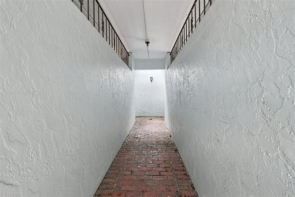 4471 Vieux Carre Circle, Unit 4471 Tampa, FL 33613 - Photo 55 of 58 a view of a hallway with wooden floor