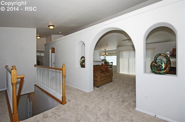 11902 Rio Secco Road Peyton, CO 80831 - Photo 3 of 23 Hall, Stairwell & Entry to Family Room