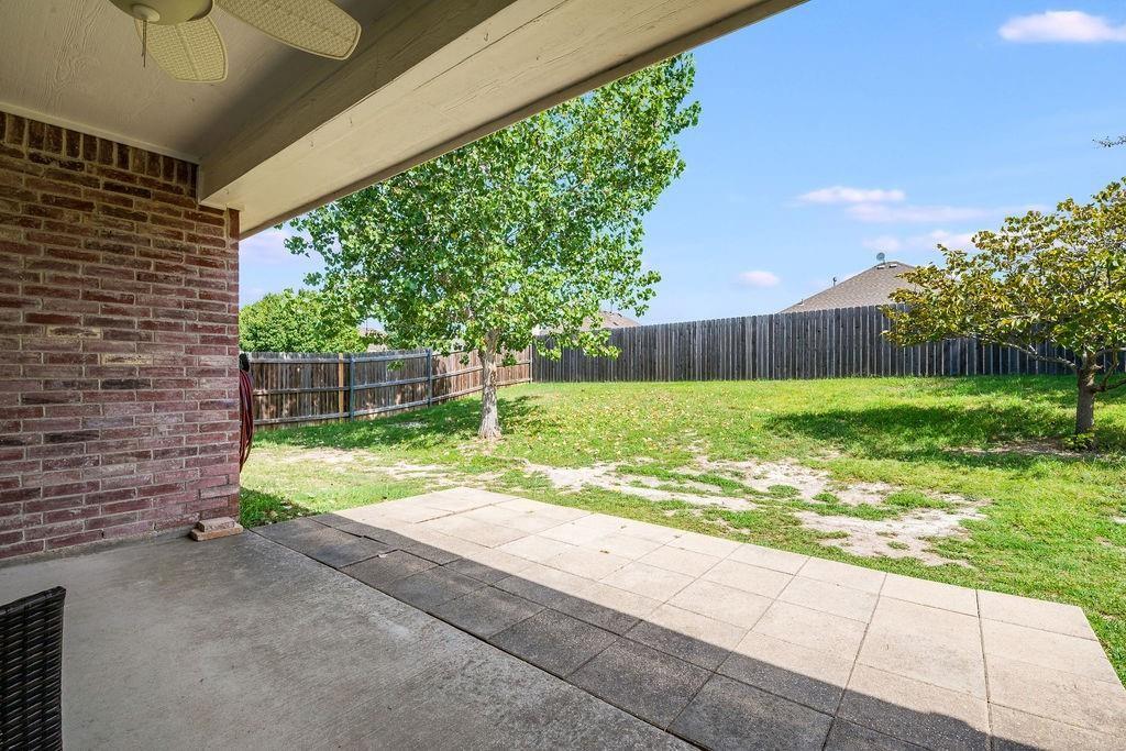3029 Canary Lane Midlothian, TX 76065 - Photo 16 of 21 Fenced backyard with a patio and a ceiling fan