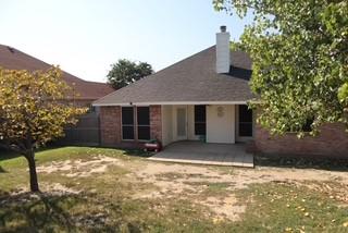 3029 Canary Lane Midlothian, TX 76065 - Photo 18 of 21 Back of property with a patio, a yard, and a chimney.