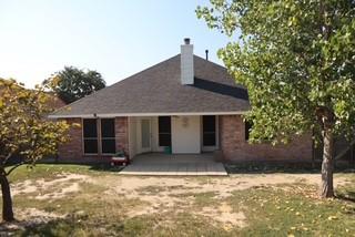 3029 Canary Lane Midlothian, TX 76065 - Photo 19 of 21 Rear view of house with a patio area, a yard, a chimney, and brick siding.