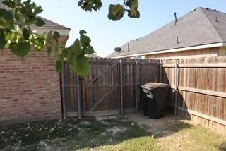 3029 Canary Lane Midlothian, TX 76065 - Photo 21 of 21 View of yard with a side gate, where you can store your trash can to hide until trash day.