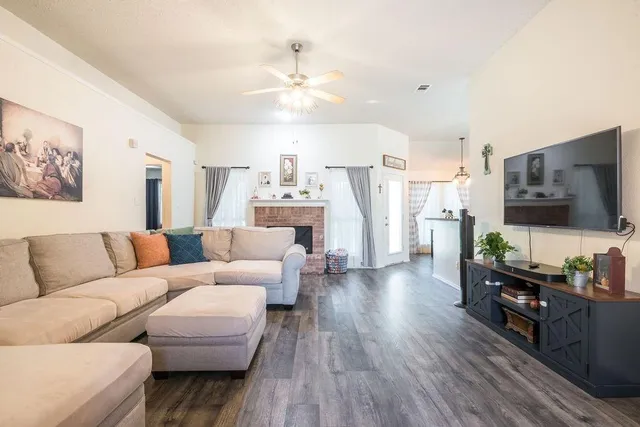 a living room with furniture and a flat screen tv