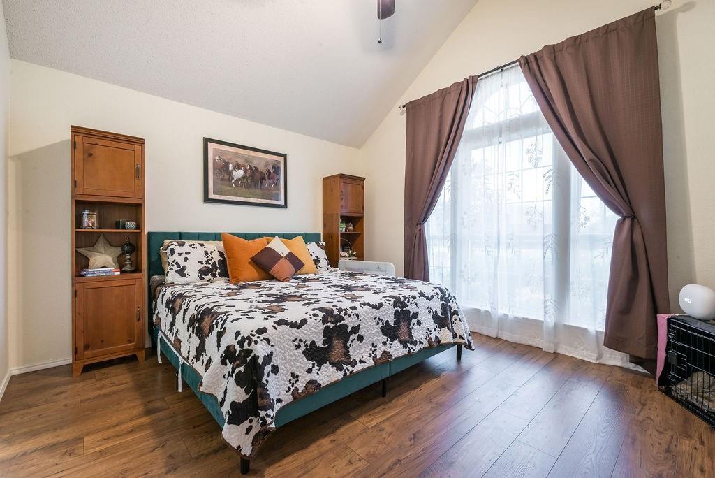 3029 Canary Lane Midlothian, TX 76065 - Photo 10 of 21 Bedroom with wood-type flooring, lofted ceiling, and a ceiling fan