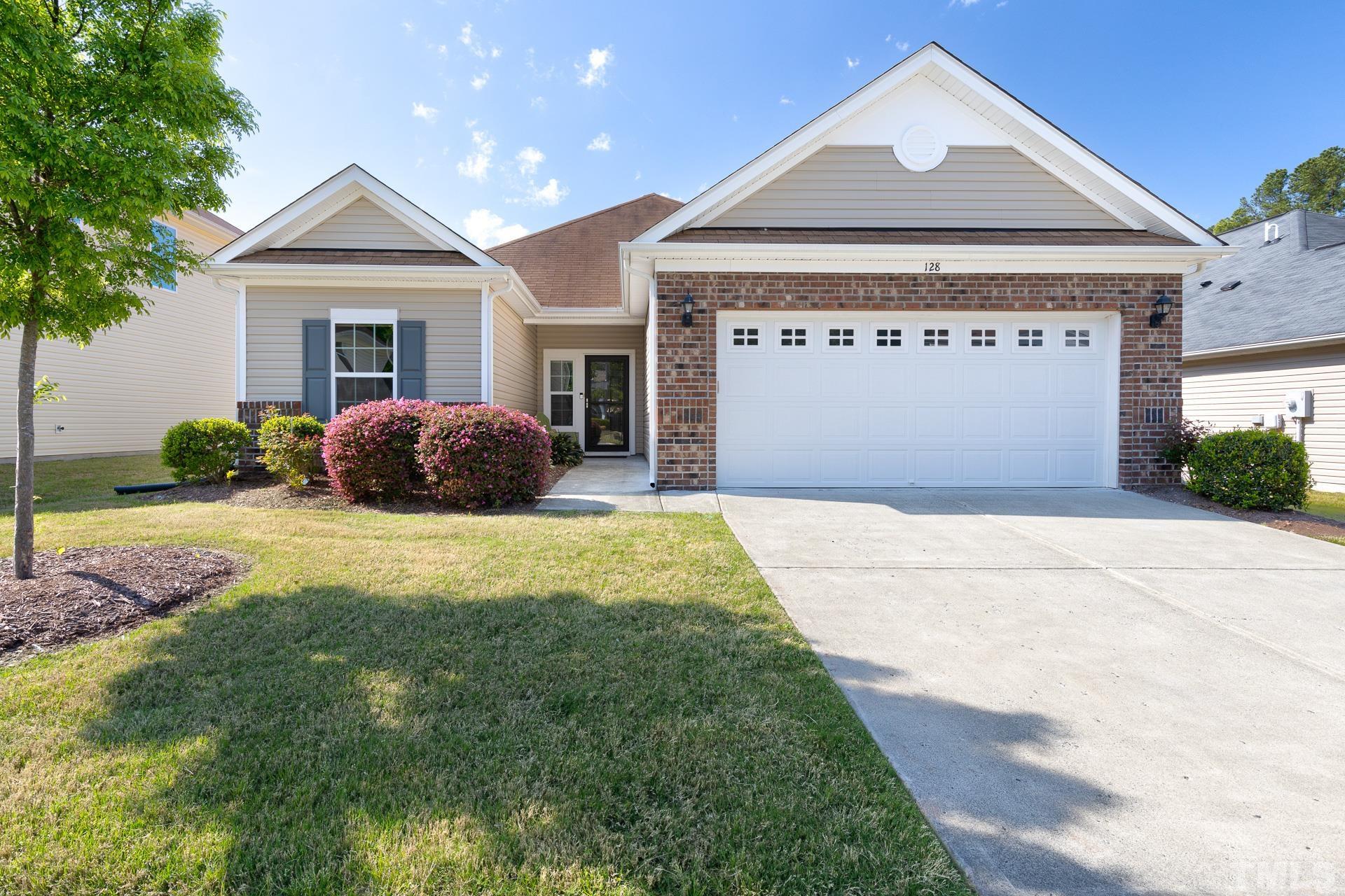 128 Rosaline Lane Durham, NC 27713 - Photo 1 of 31 a front view of a house with garden