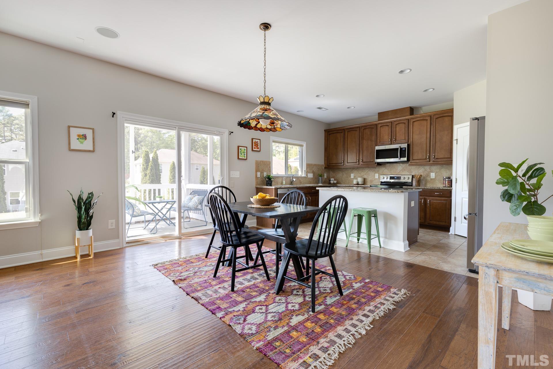 128 Rosaline Lane Durham, NC 27713 - Photo 11 of 31 a view of a dining room with furniture window and wooden floor