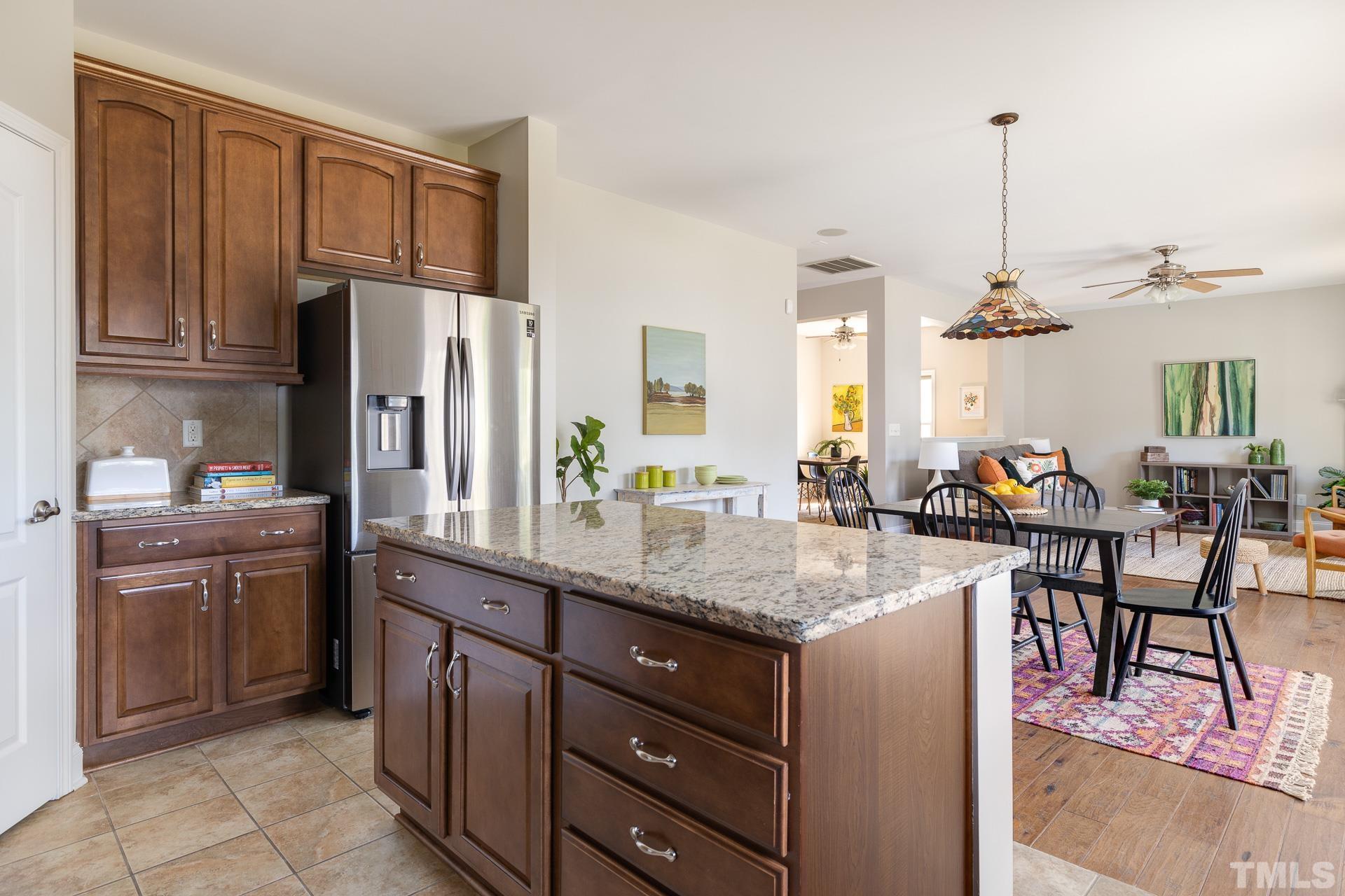 128 Rosaline Lane Durham, NC 27713 - Photo 15 of 31 a kitchen with center island table and chairs