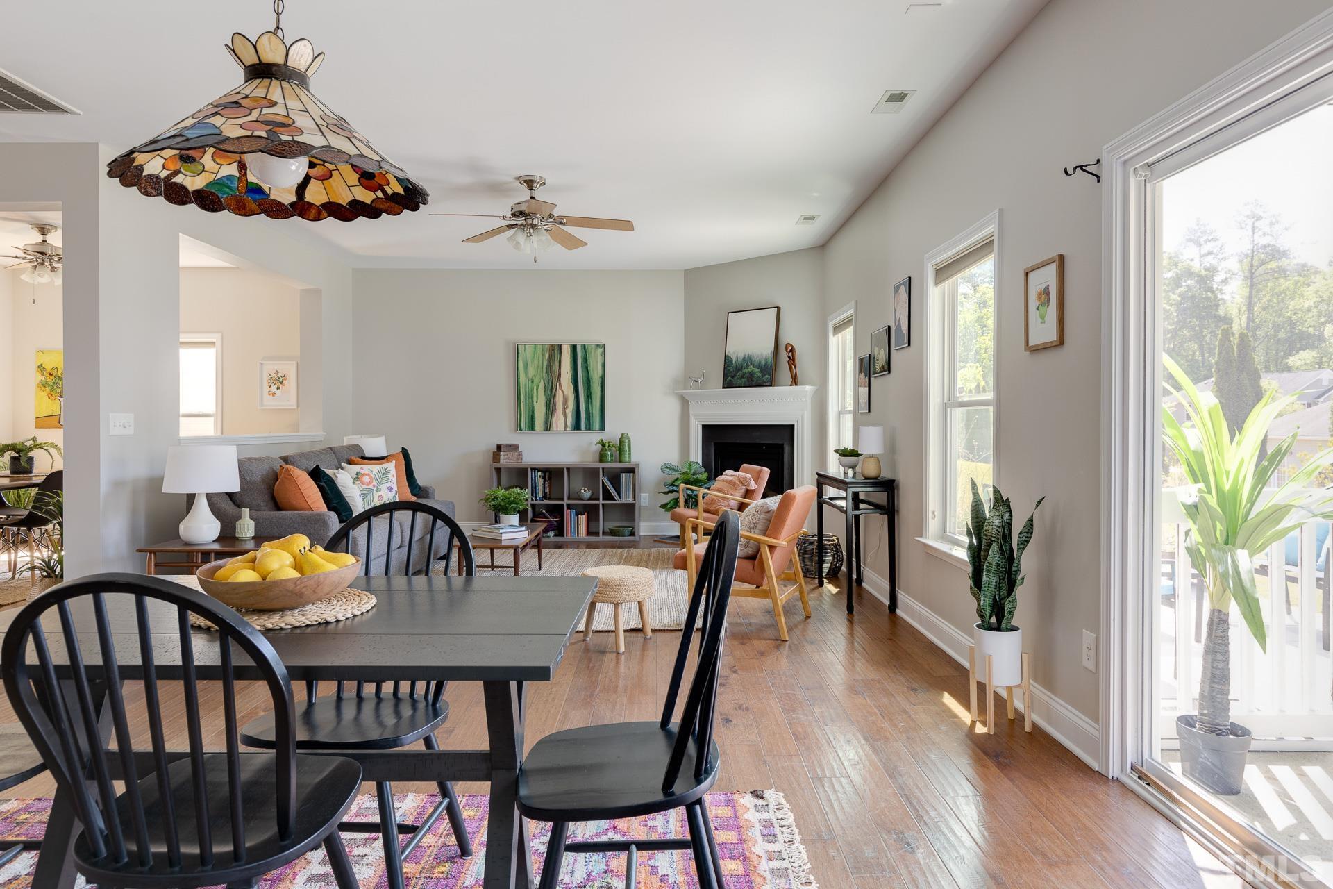 128 Rosaline Lane Durham, NC 27713 - Photo 16 of 31 a view of a dining room with furniture window and wooden floor