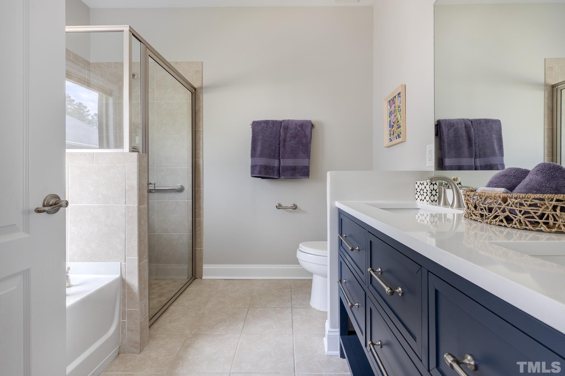 128 Rosaline Lane Durham, NC 27713 - Photo 20 of 31 a bathroom with a sink a toilet and shower