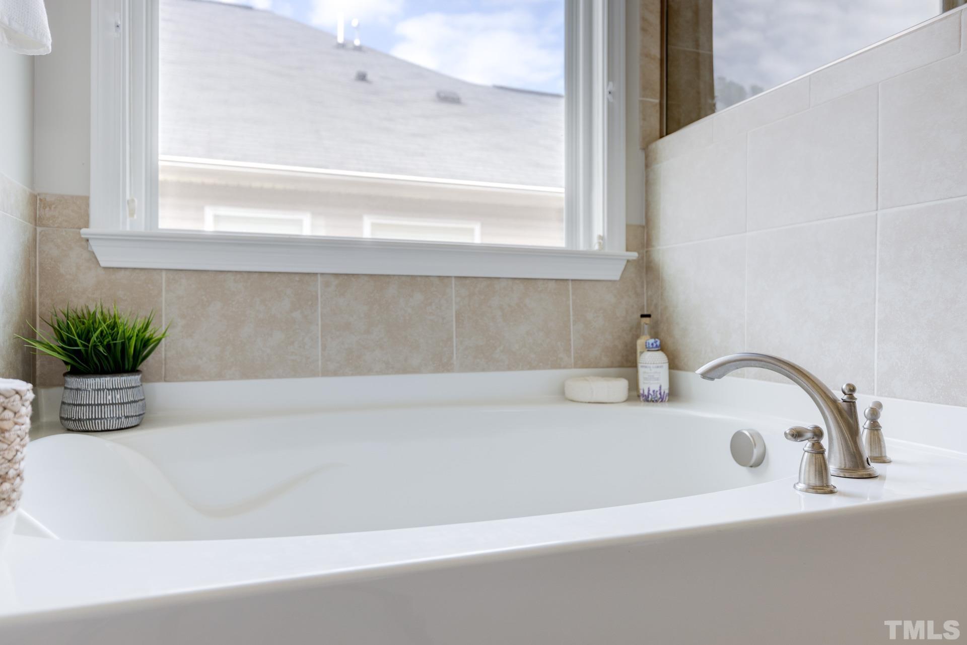 128 Rosaline Lane Durham, NC 27713 - Photo 23 of 31 a bathroom with a bathtub
