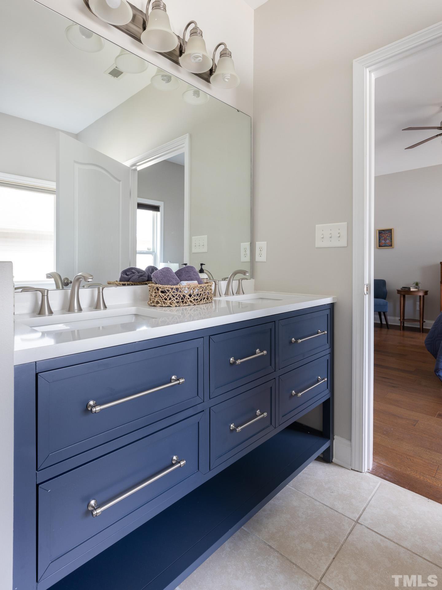 128 Rosaline Lane Durham, NC 27713 - Photo 24 of 31 a bathroom with a granite countertop sink and a mirror
