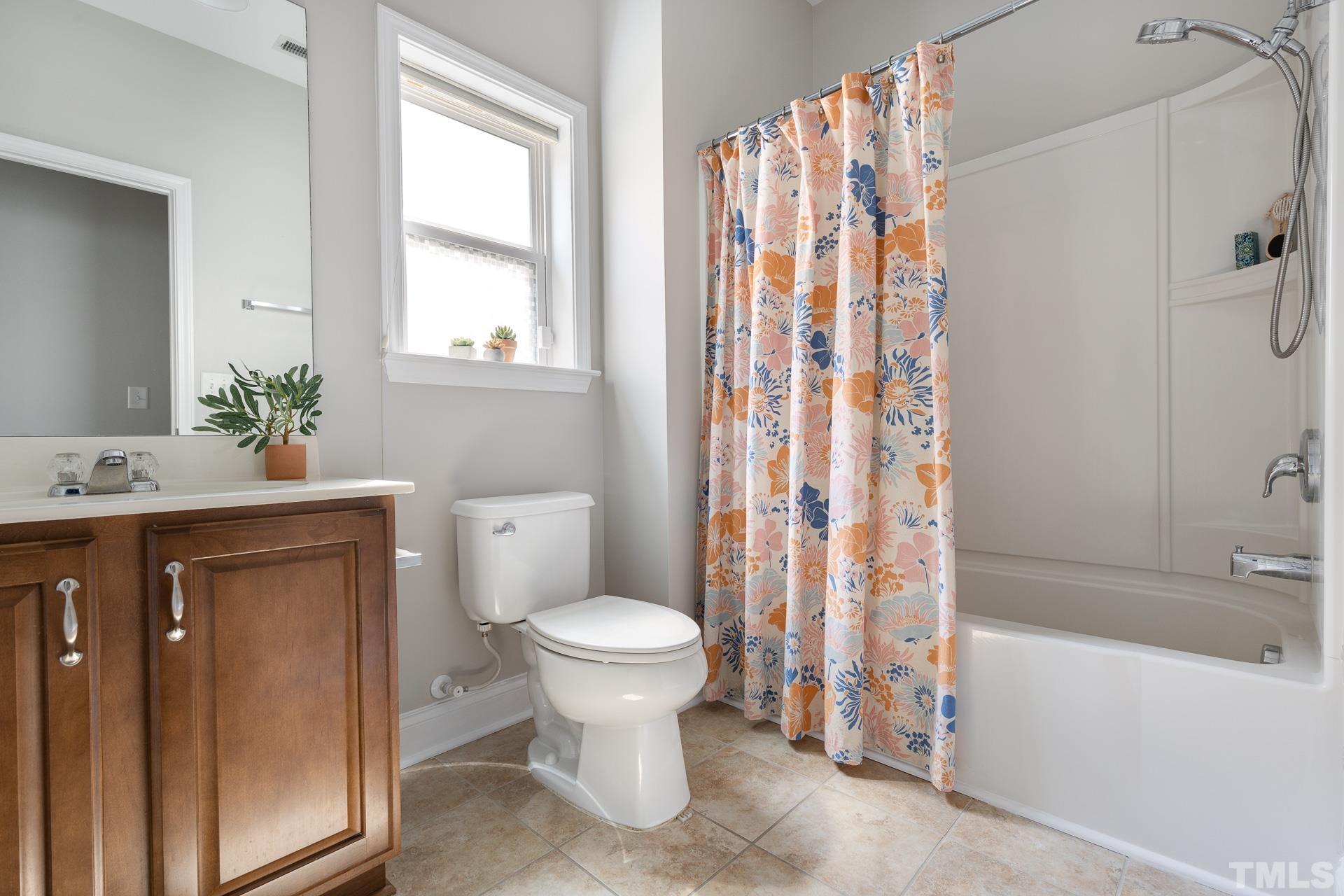 128 Rosaline Lane Durham, NC 27713 - Photo 26 of 31 a bathroom with a sink toilet and shower