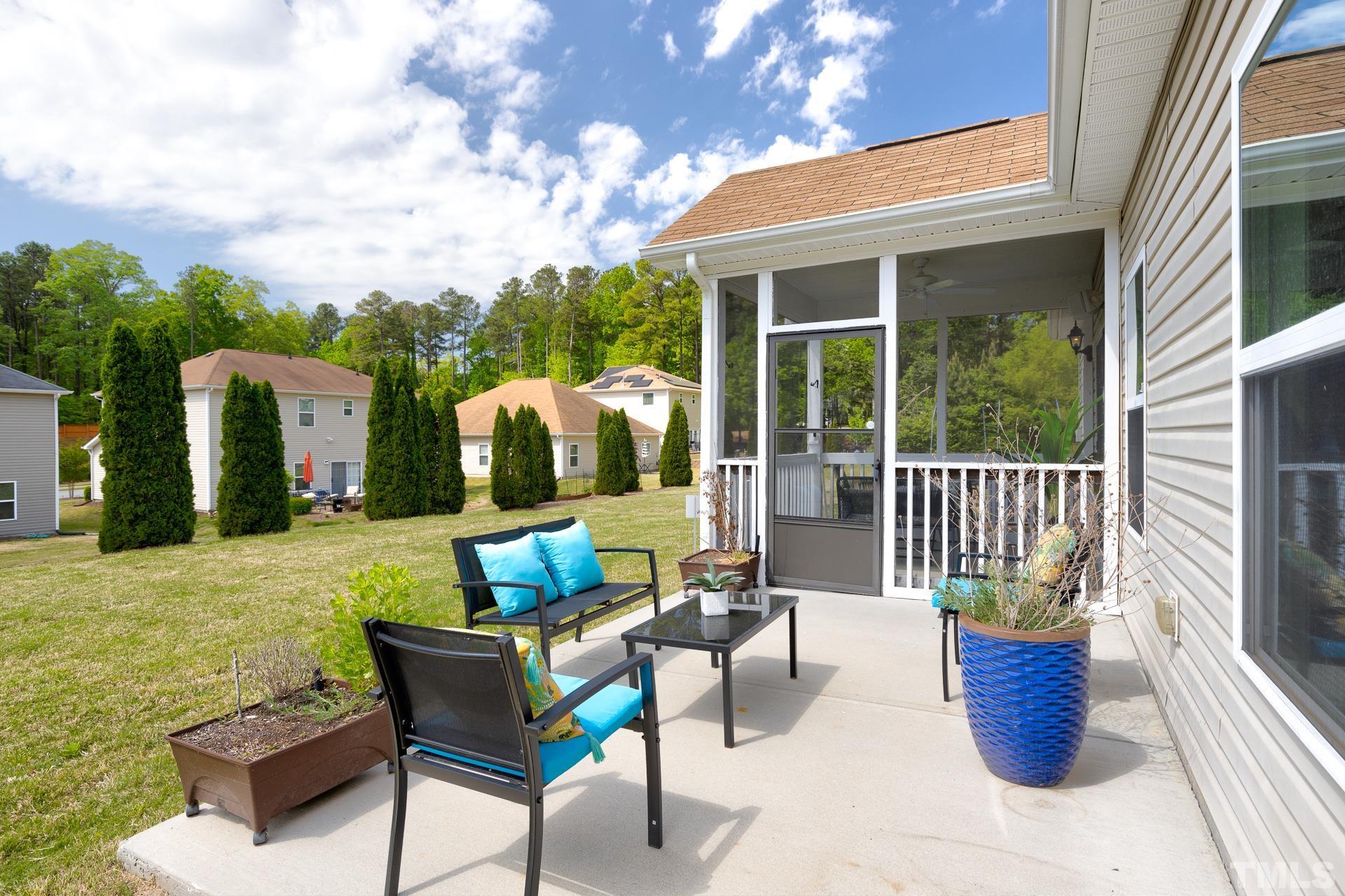 128 Rosaline Lane Durham, NC 27713 - Photo 30 of 31 a view of a patio with couches chairs and potted plants