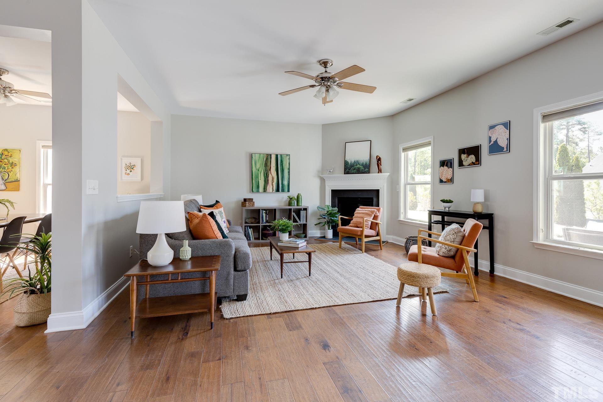 128 Rosaline Lane Durham, NC 27713 - Photo 6 of 31 a living room with furniture and a wooden floor