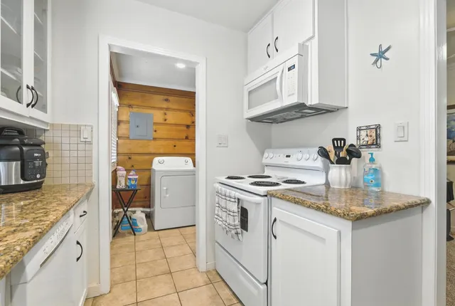 a kitchen with stainless steel appliances granite countertop a stove and a sink