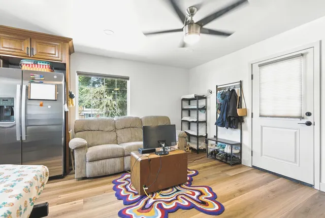 a living room with furniture and a window