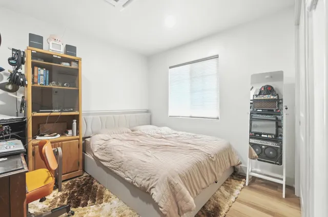 a bedroom with a bed furniture and a window