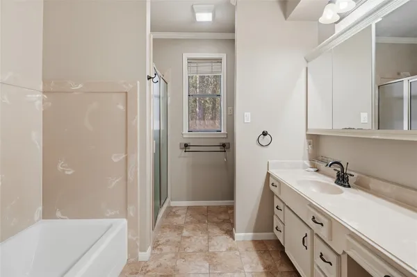 a bathroom with a sink vanity granite and a mirror