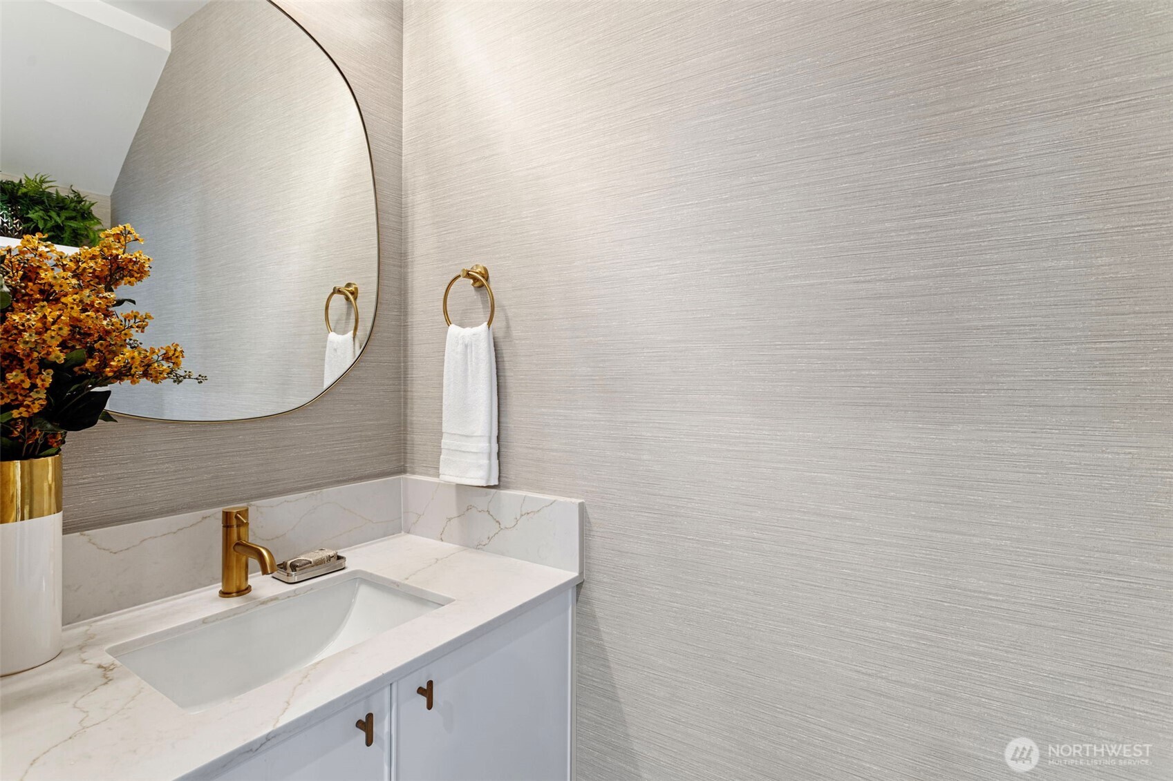 8007 25th Avenue Northwest Seattle, WA 98117 - Photo 13 of 31 a bathroom with a sink and a mirror