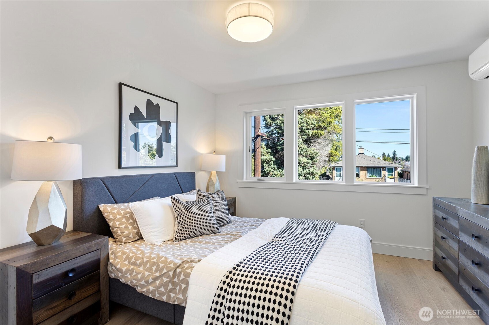 8007 25th Avenue Northwest Seattle, WA 98117 - Photo 21 of 31 a bedroom with a bed and a window