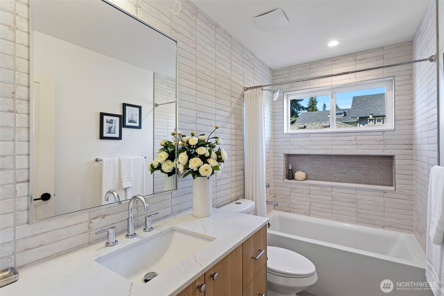 8007 25th Avenue Northwest Seattle, WA 98117 - Photo 22 of 31 a bathroom with a sink a toilet and bathtub