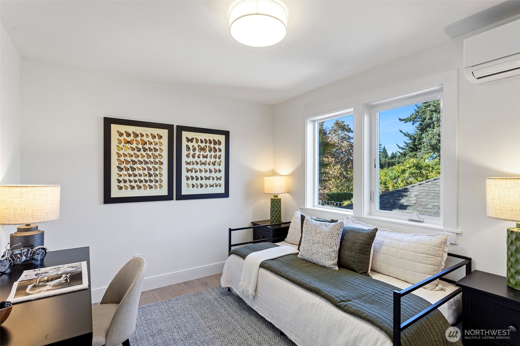 8007 25th Avenue Northwest Seattle, WA 98117 - Photo 23 of 31 a living room with furniture and a large window