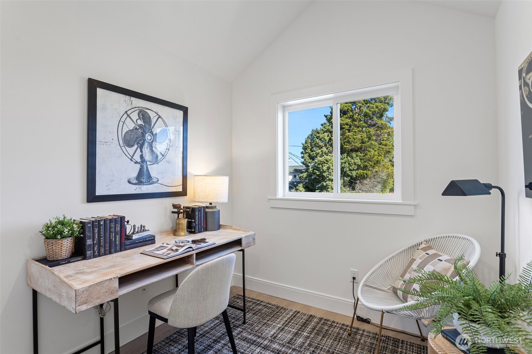 8007 25th Avenue Northwest Seattle, WA 98117 - Photo 24 of 31 a view of a workspace with furniture and a window